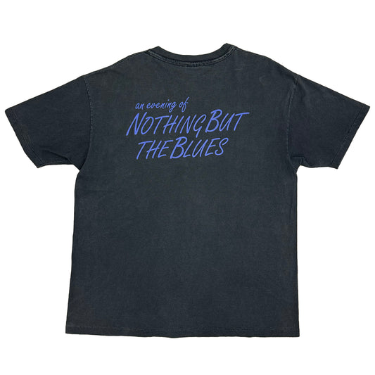 back of shirt says "an evening of nothing but the blues" in blue on black shirt
