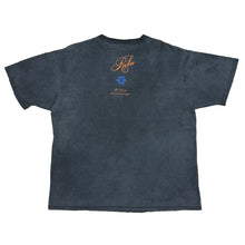 Load image into Gallery viewer, back side of shirt has reba name in orange and a blue flower and then it saysv 20 year anniversary in orange below.