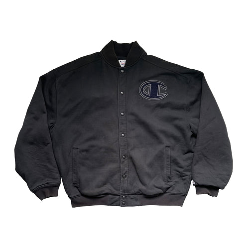 BLACK BUTTON UP CHAMPION JACKET WITH CHAMPION LOGO ON LEFT CHEST OF SHERPA FABRIC. 2 HAND POCKETS