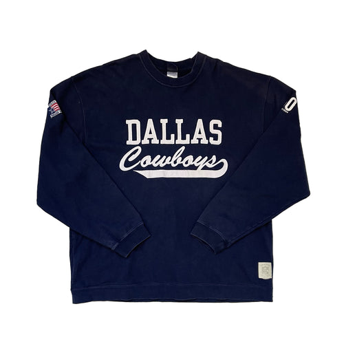 navy pullover with dallas cowboy lettering in white in patches. american flag on top right sleeve and 60 years on the top left sleeve. gridiron classic satin tag on bottom left side.