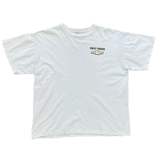 white t short sleeve shirt. with the chevy logo on left side and chevy trucks above it