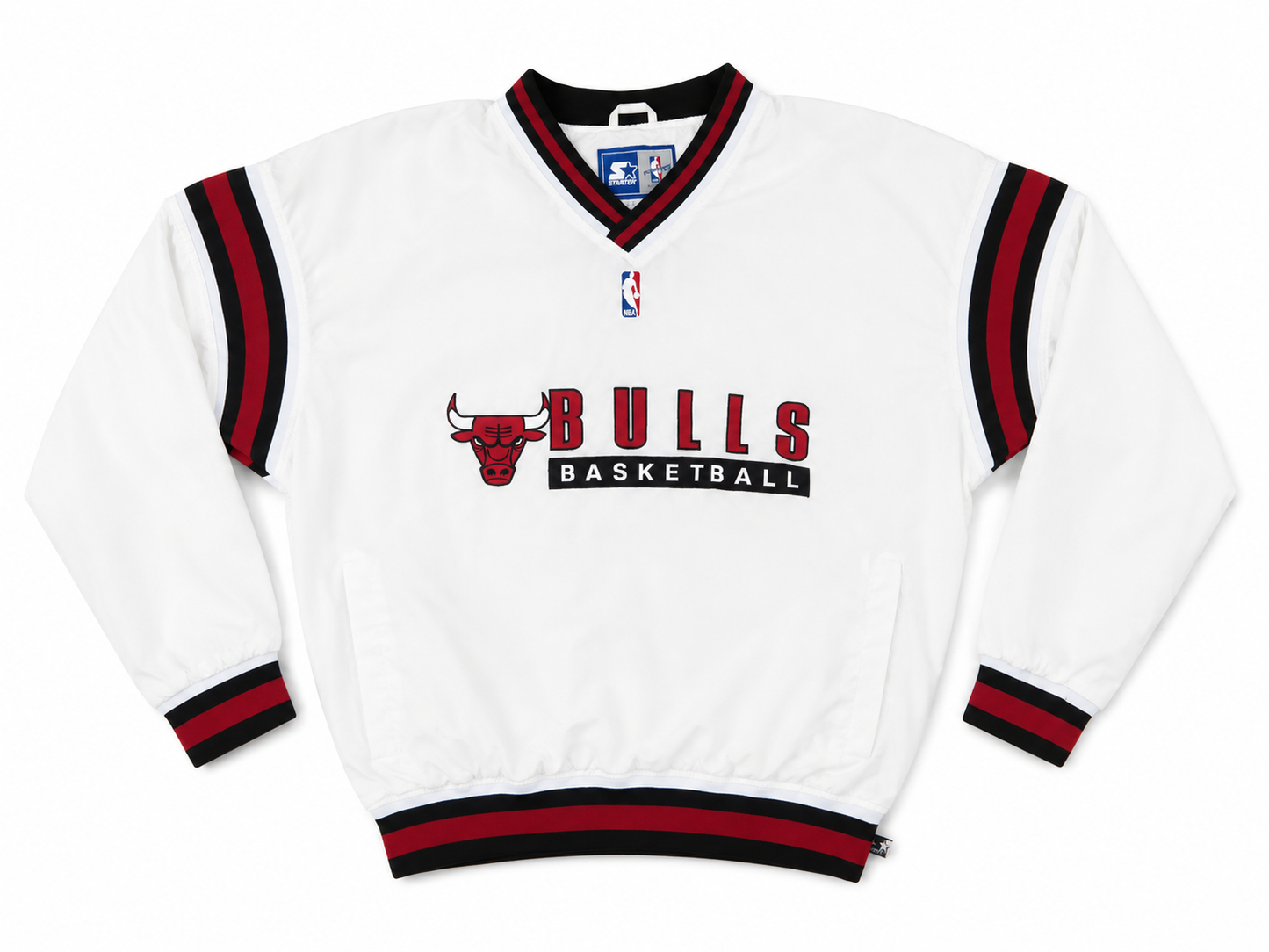 A white Chicago Bulls Basketball pullover jacket with red and black striped trim on the collar, cuffs, and hem, featuring the team logo and 'BULLS BASKETBALL' text on the front.