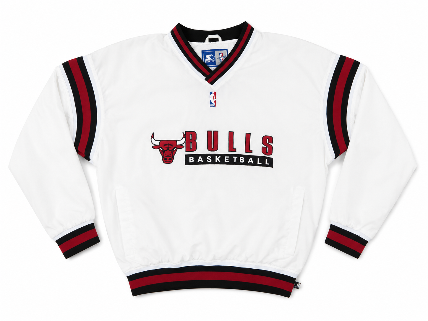 A white Chicago Bulls Basketball pullover jacket with red and black striped trim on the collar, cuffs, and hem, featuring the team logo and 'BULLS BASKETBALL' text on the front.