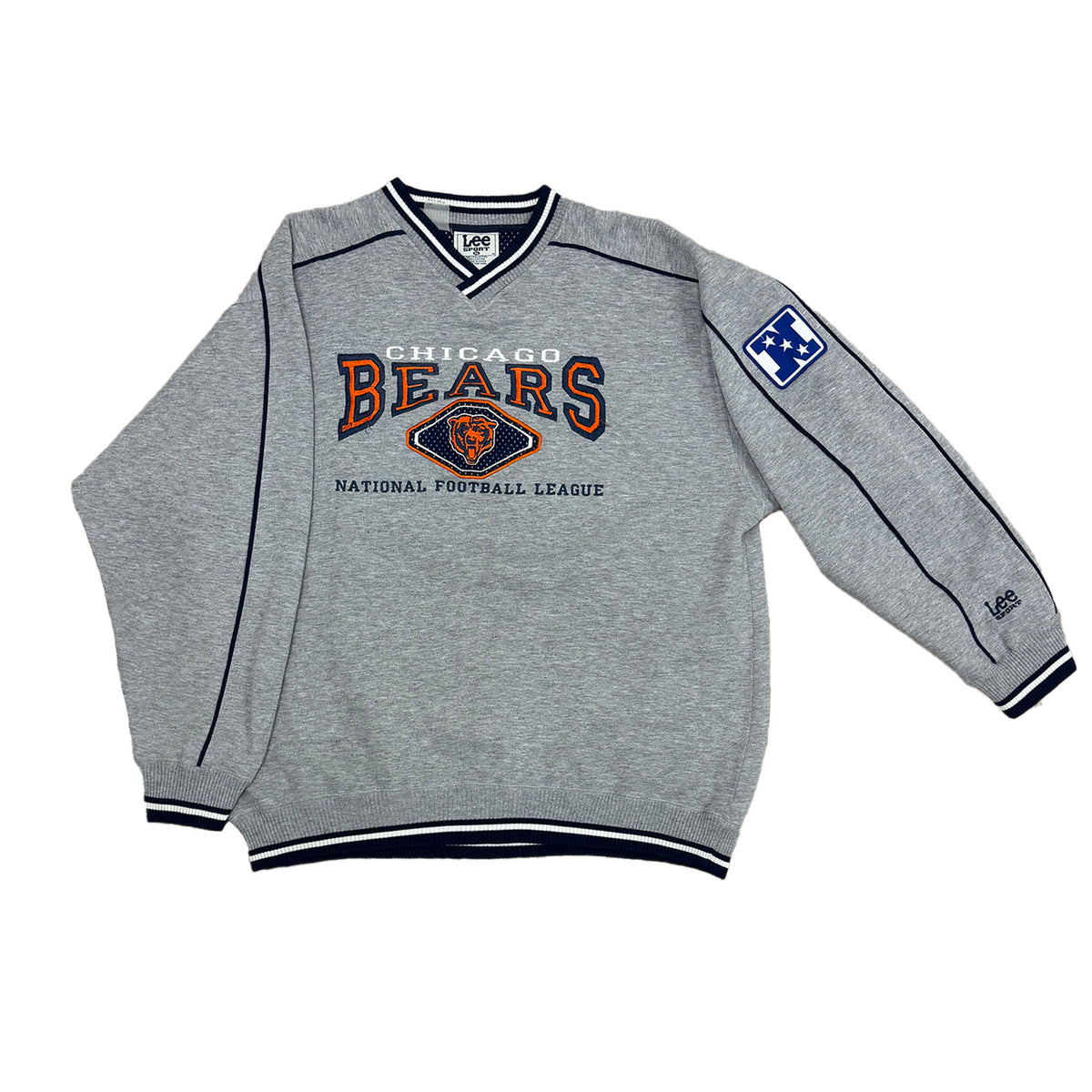 gray vneck sweatshirt bwith chicago bears logo on the front and the n logo on the left sleeve and says lee sport on the sleeve.