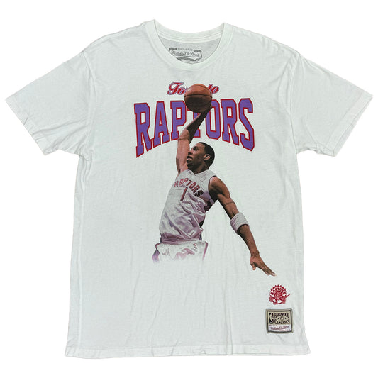 white shirt with toronto raptors in purple lettering and tracy mcgrady ready to dunk. hardwood classic labeling on bottom left bcorner of shirt