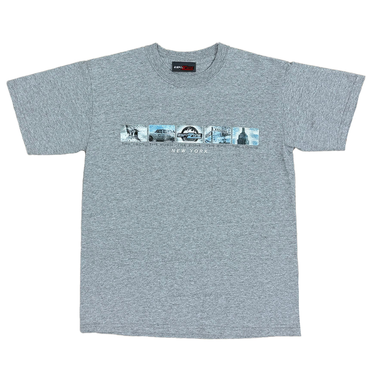 GRAY SHORT SLEEVE SHIRT WITH ESPN ZONE LOGO ON THE FRONT WITH IMAGES OFR STATUE OF LIBERTY, TAXI, CRYSLER BUILDING AND THEV WORD NEW YORK BELOW IMAGES