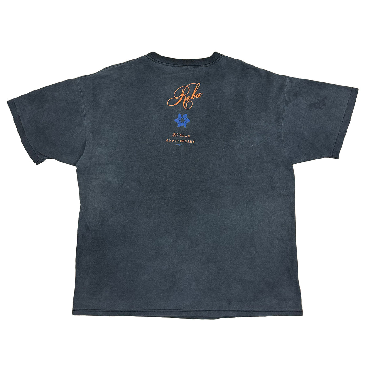 back side of shirt has reba name in orange and a blue flower and then it saysv 20 year anniversary in orange below.
