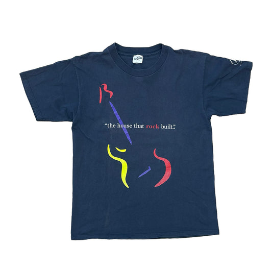 ROCK AND ROLL HALL OF FAME SHIRT. 1996. "THE HOUSE THAT ROCK BUILT" WITH A GUITAR WITH YELLOW, RED, AND BLUE