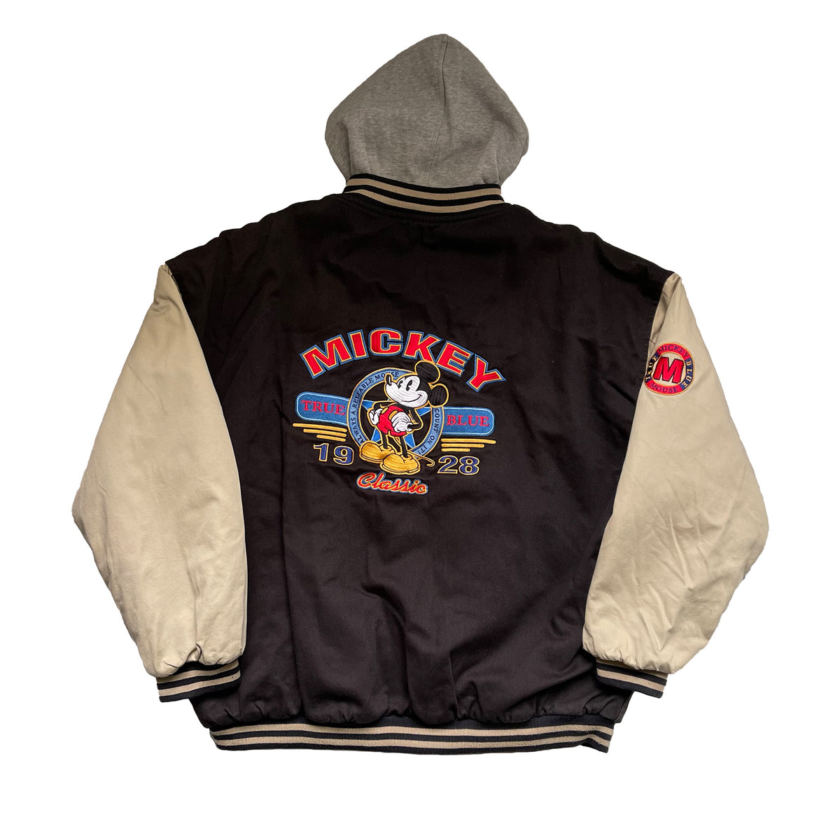 BACKSIDE: MICKEY MOUSE PATCH WITH 1928 AND A SMALL MI PATCH FOR MICKEY MOUSE ON THE SLEEVE